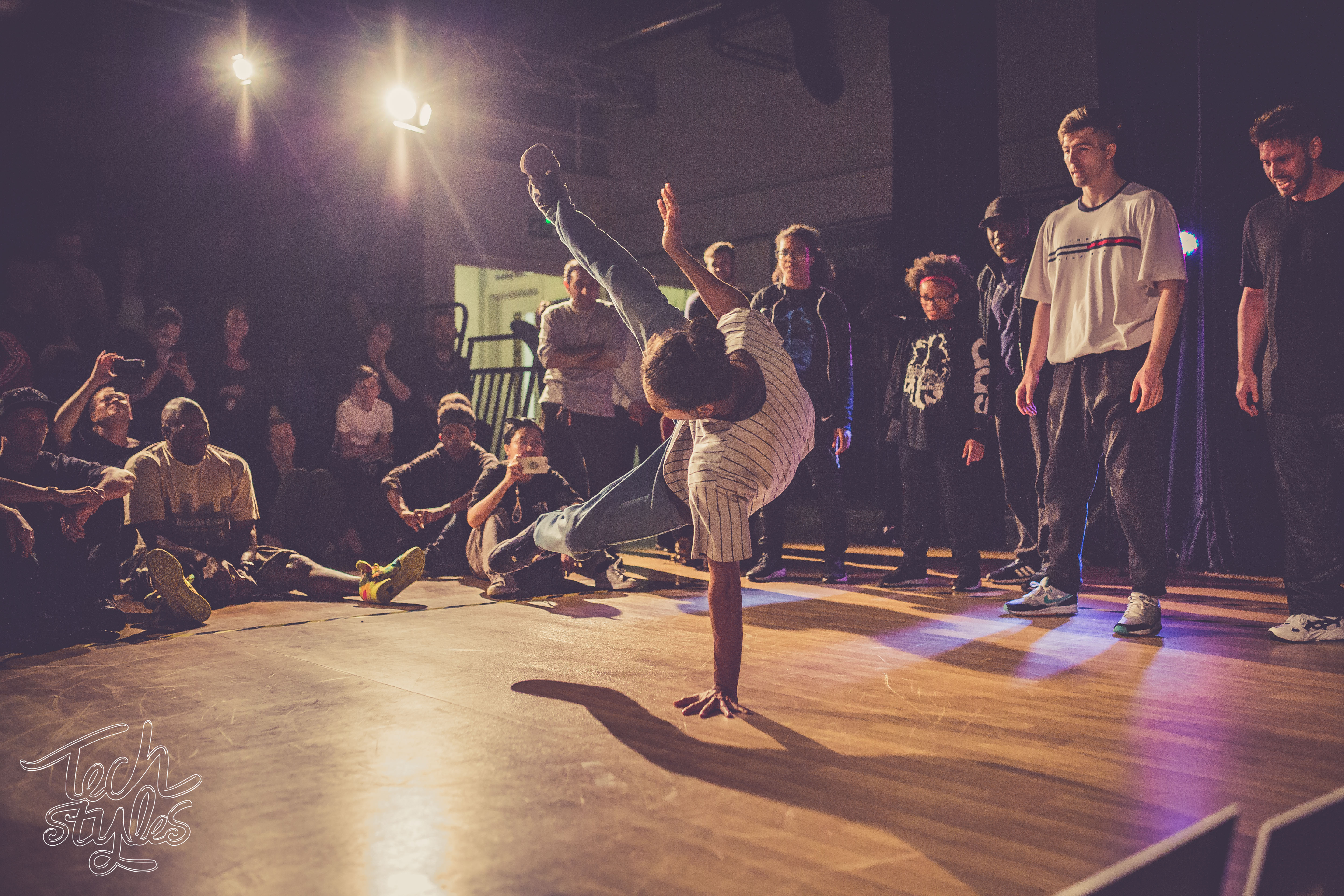 break dancing on a wooden stage