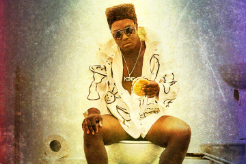 A person sitting on a toilet