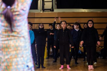 A group of students watching an instructor.